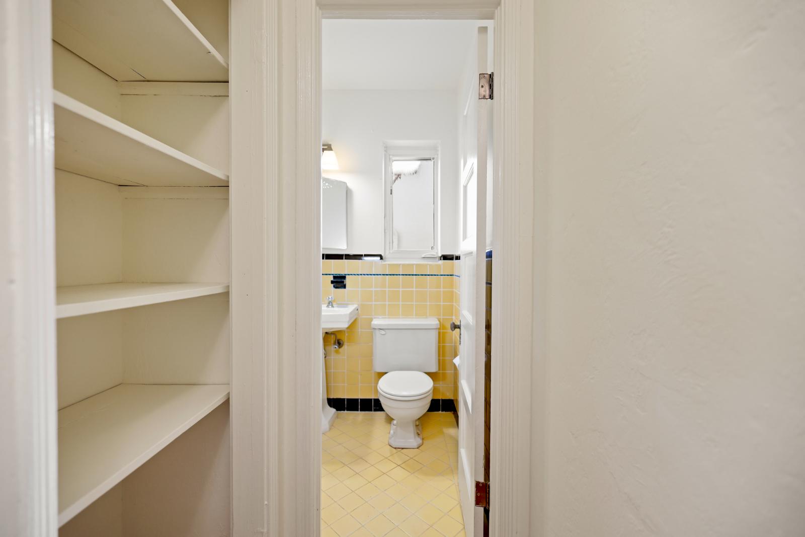 Bathroom detail with shelving and vintage character