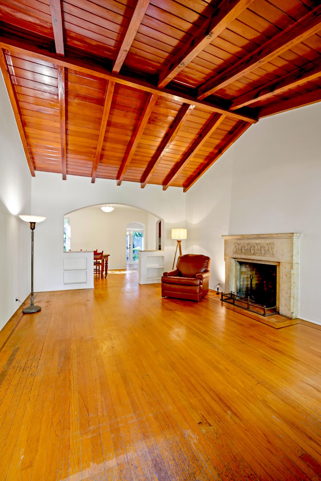 Living room view with wood ceiling detail and warm architectural character