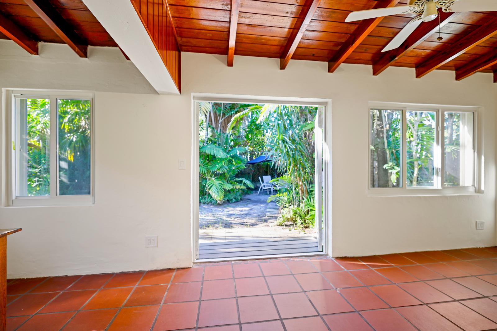 Sunroom with garden-facing opening and strong indoor-outdoor connection
